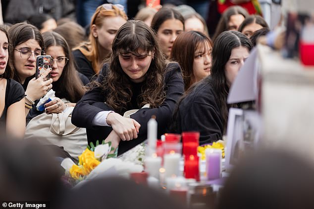 Liam Payne fans cried at a memorial in Madrid's Santa Ana Square yesterday