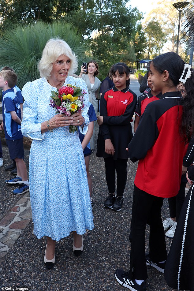 At the Botanical Gardens, Camilla chatted with local schoolchildren, who presented her with flowers