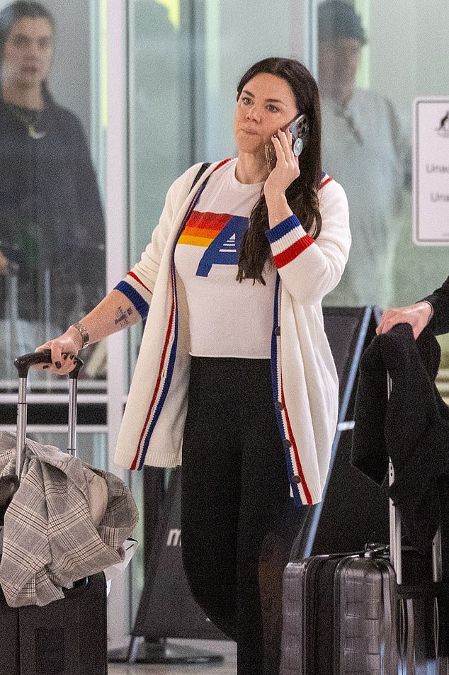 The Australian singer, 43, who recently won a lawsuit against her mother, went for a casual look as she arrived at her hometown airport