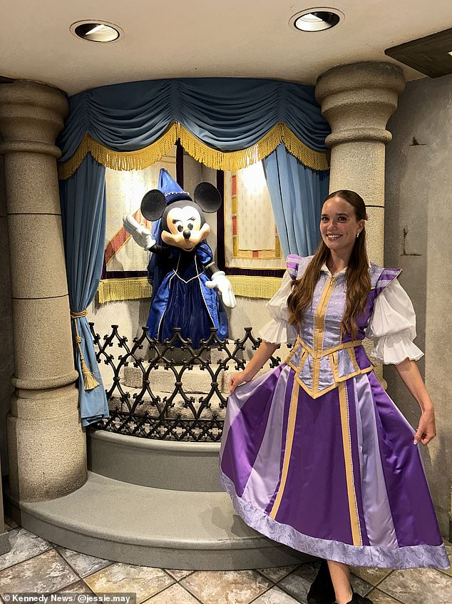 The graduate of Bishop Grosseteste University in Lincoln said she dressed in her assigned Disney uniform during her shifts, but on her days off created her own themed outfits to wear at the theme parks. She is shown at work