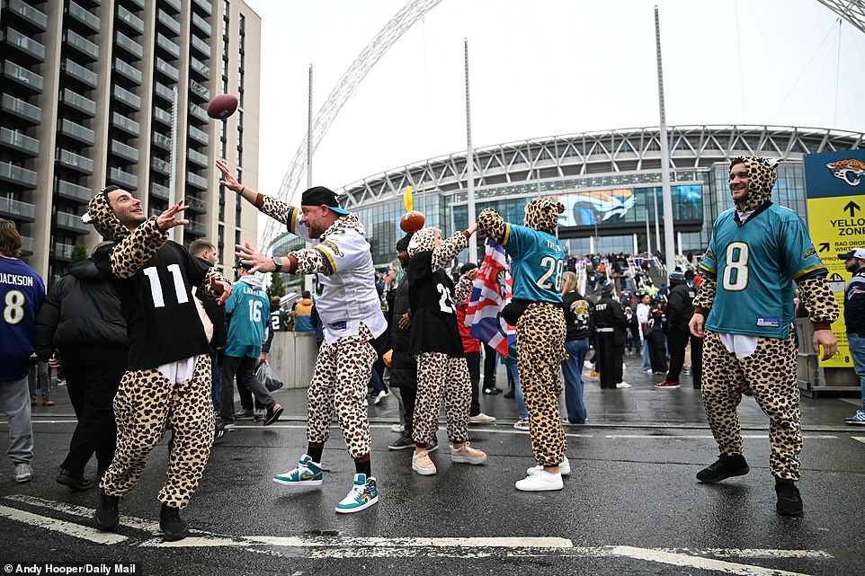 Fans of the two teams braved the rainy conditions on Wembley Way ahead of the NFL match in London at the National Stadium