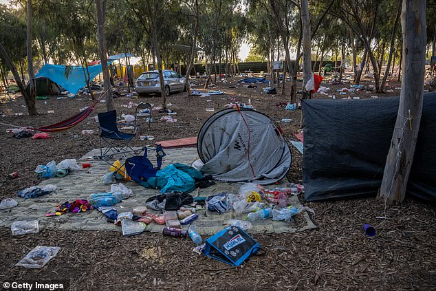 Destroyed cars and personal belongings still litter the grounds of the Supernova Music Festival, where hundreds were killed and dozens taken by Hamas militants near the Gaza border, on October 13, 2023 in Kibbutz Re'im, Israel