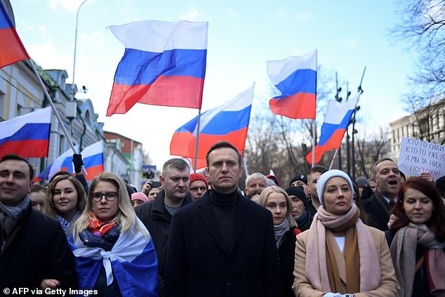 Russian opposition leader Alexei Navalny, his wife Yulia, opposition politician Lyubov Sobol and other demonstrators march in memory of murdered Kremlin critic Boris Nemtsov in central Moscow on February 29, 2020