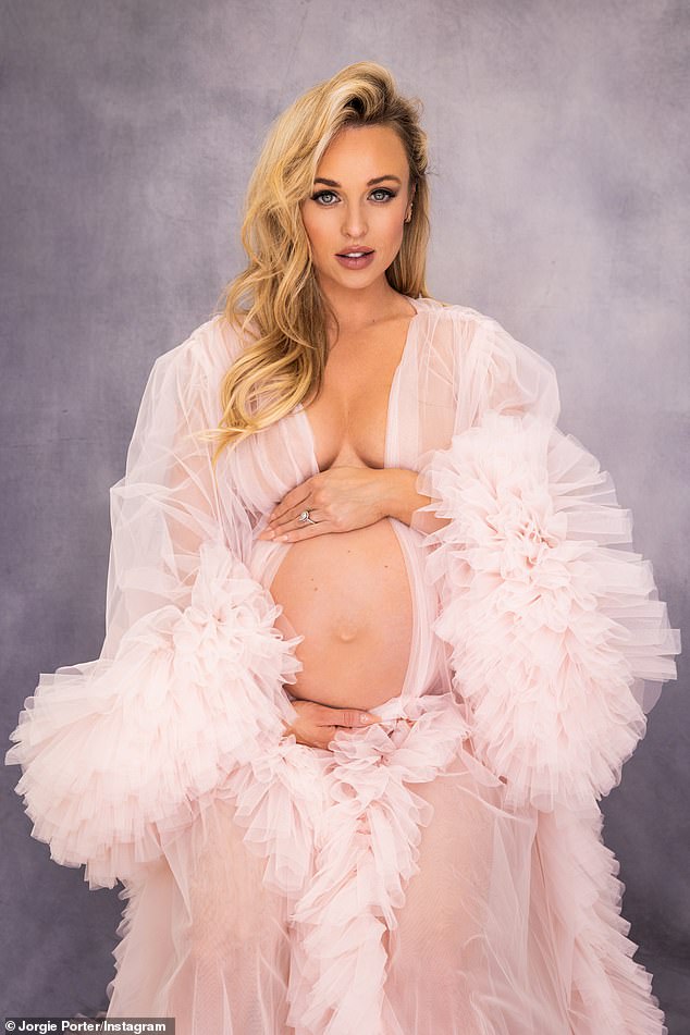 In the third trimester, Jorgie beamed as she stripped naked and wore nothing but a chiffon dressing gown