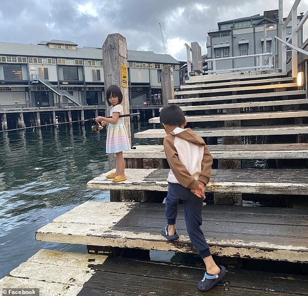 Hoai and her children - Hazel 5 and Mitchell, 7, (pictured on a fishing adventure) drowned in the Georges River on Saturday