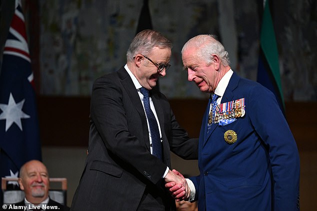 The king shakes hands with Australian Prime Minister Anthony Albanese during his state visit