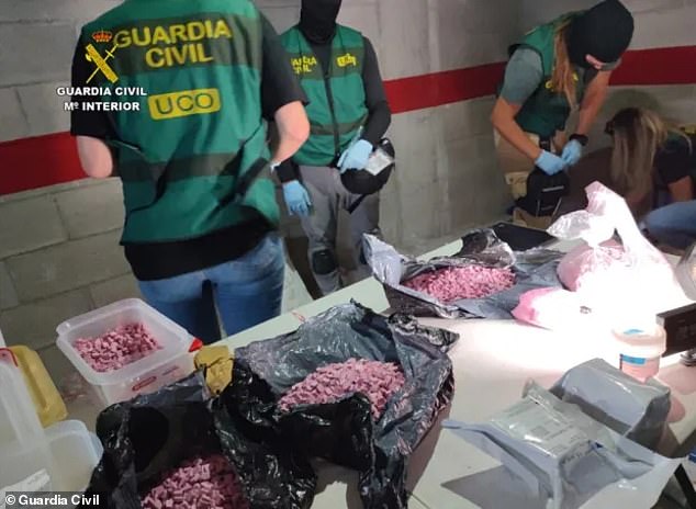 Also known as 'tuci' or 'tusi' or 'Pantera Rosa', the drug is native to Colombia but has been found in the US, Spain and the UK. Pictured are pink cocaine supplies being seized by Spanish police