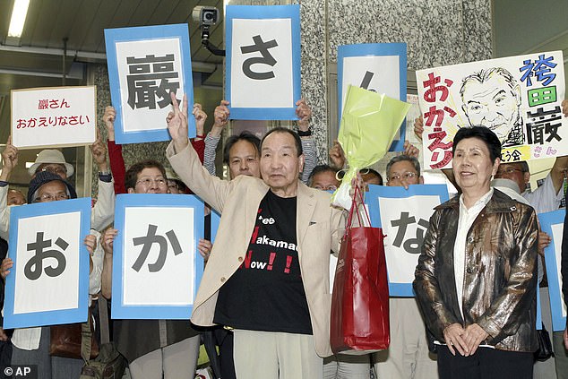 Iwao Hakamada is welcomed by supporters as he arrives in Hamamatsu, Shizuoka Prefecture, central Japan, on May 27, 2014