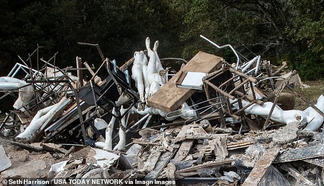 Debris from Hurricane Helene is piled up on land owned by the city of Asheville