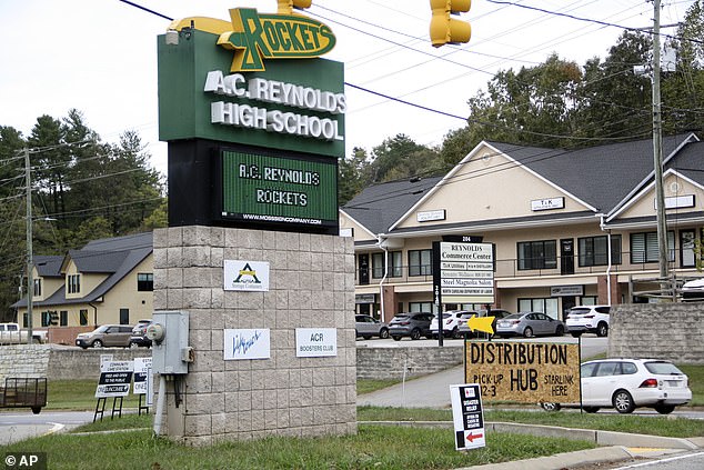 Signs are seen at a FEMA Disaster Recovery Center at A.C. Reynolds High School in Asheville