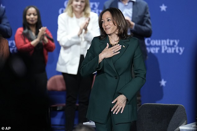 Democratic presidential candidate Vice President Kamala Harris gestures at the conclusion of a town hall at the Royal Oak Theater in Royal Oak, Michigan, Monday, Oct. 21, 2024.