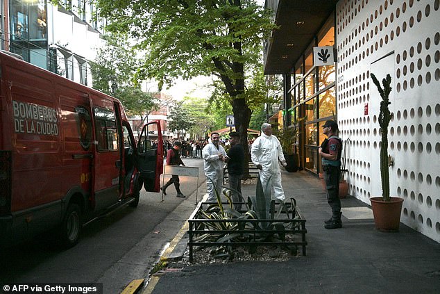 Forensic teams arrive at the Casa Sur Hotel in Buenos Aires on October 16 to investigate