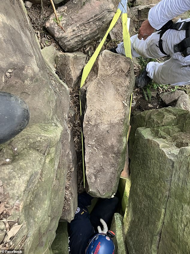 The woman was safely freed after rescuers moved a 500kg boulder