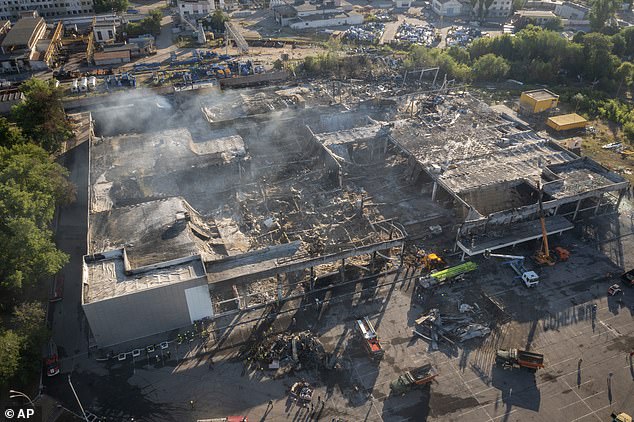 Smoke rises from the ruins of the Amstor shopping center in the city of Kremenchuk, central Ukraine, after it was hit by long-range guided missiles in June 2022