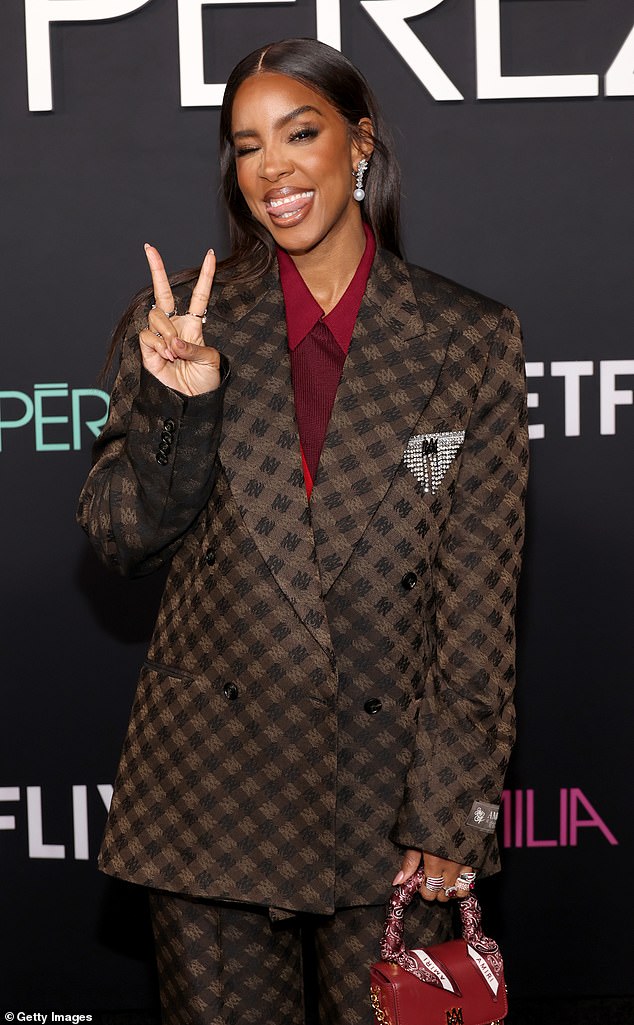 The 43-year-old singer and actress wore a brown and black patterned Amiri suit over a burgundy shirt