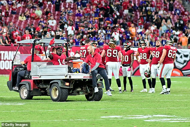 Godwin was carted off the field after an air cushion was placed around his apparent dislocated ankle