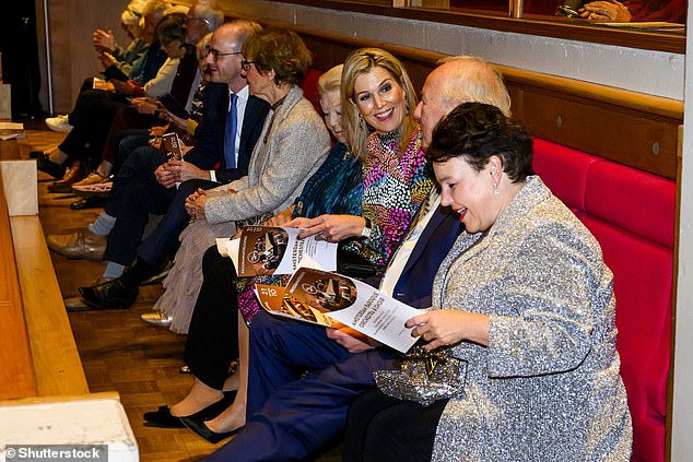 Máxima wore her long, blonde hair in a classic blow-dry for the event and had her complexion brightened with a gold bronzer and a touch of berry-colored lipstick