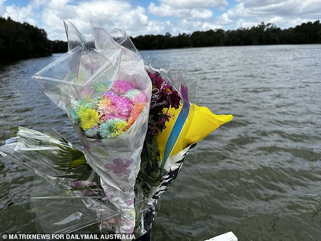 Pictured: Floral tributes left at the spot where Mrs Doan and her children died on Saturday