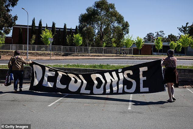 Some protesters unfurled a banner reading 'DECOLONISE' - in a message to King Charles and Queen Camilla