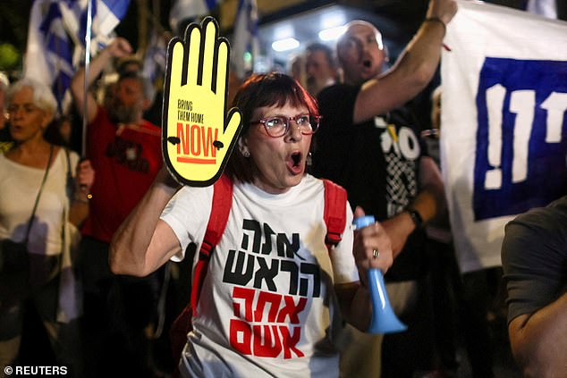 Protesters attend a demonstration against the government of Israeli Prime Minister Benjamin Netanyahu and demand a deal to release all hostages held in Gaza during the Israeli-Hamas conflict, near Netanyahu's private residence in Jerusalem on June 20