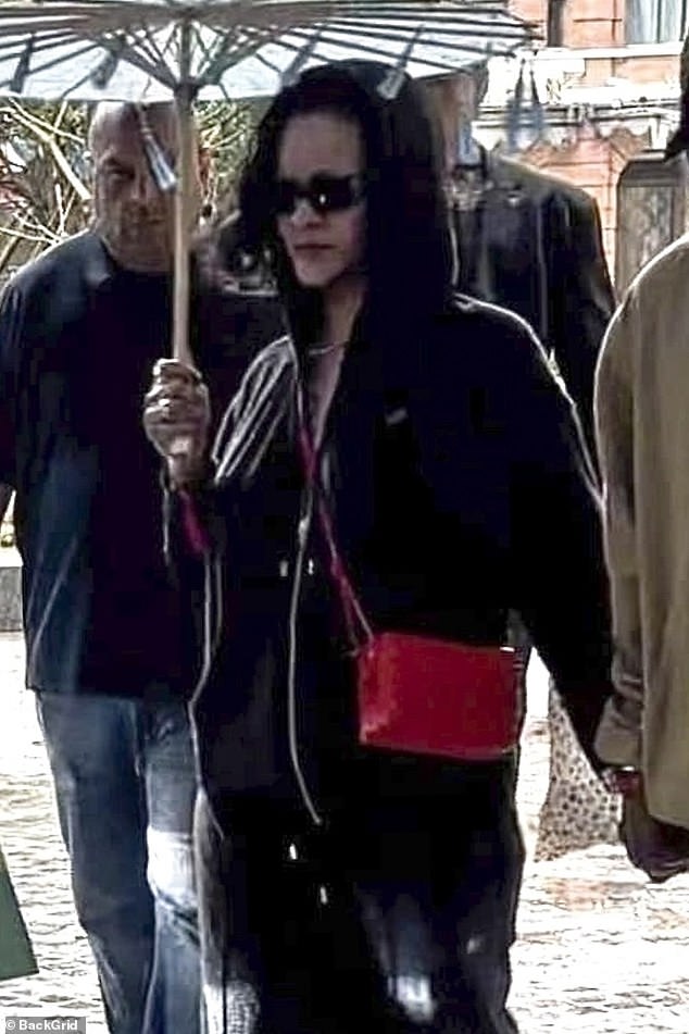 The 36-year-old singer, who was in town for Fashion Week, shielded her face with a black hoodie and sunglasses