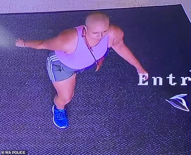 The woman (pictured), who was wearing a pink shirt and gray shorts with white stripes on the side, then fled the scene while police had not yet tracked her down