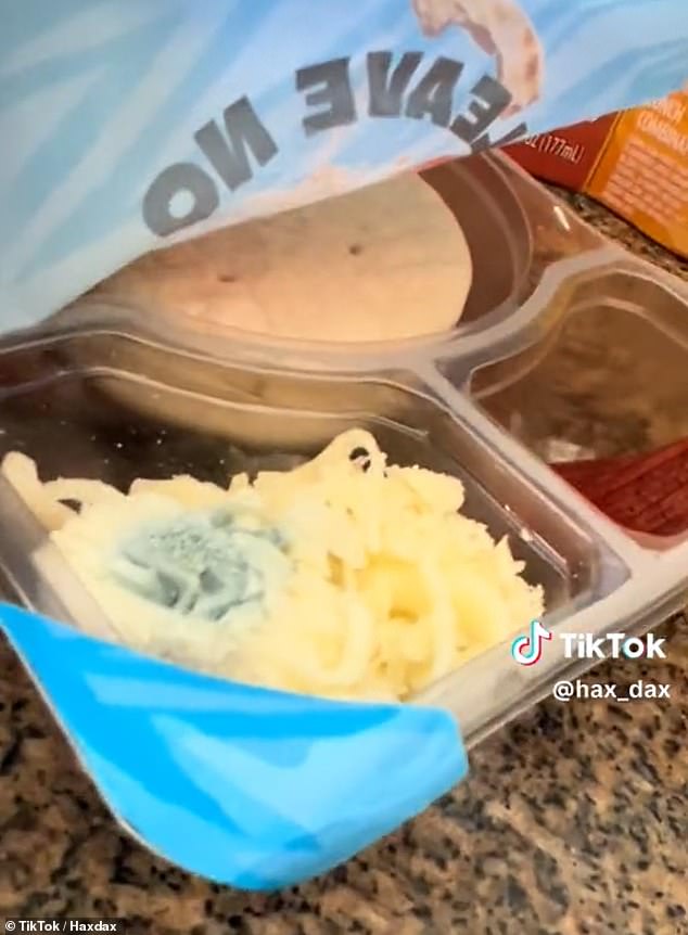 TikTokker opens the package and sees what appears to be mold on the grated cheese