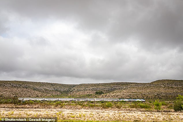 Sanderson gets nine train arrivals a week. In this image, the Amtrak Sunset Limited train travels through the desert near the small town