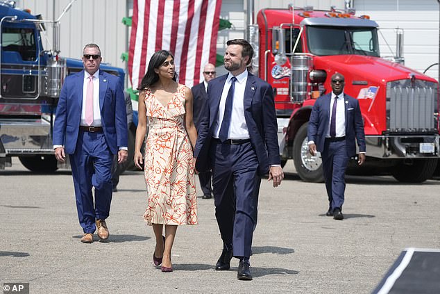 Vance walks with her husband before speaking at a campaign event in Byron Center, MI, on August 14