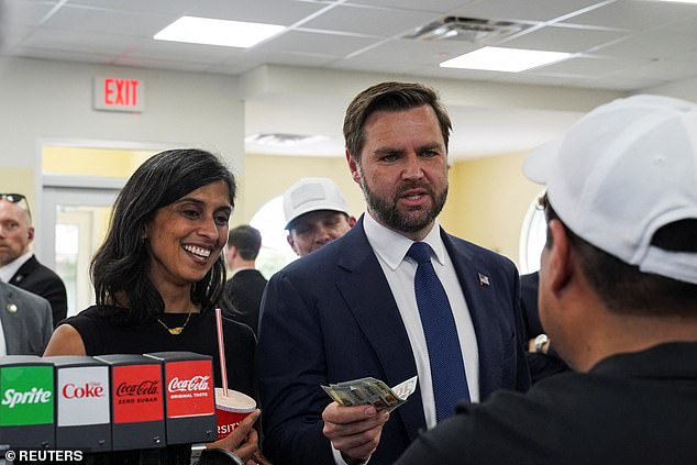 Usha Vance stands next to her husband JD with money in a Varsity on the campaign trail in Rome, Georgia