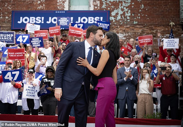 The Vances pack on the PDA with a hug at a campaign rally in Rome, Georgia on October 4