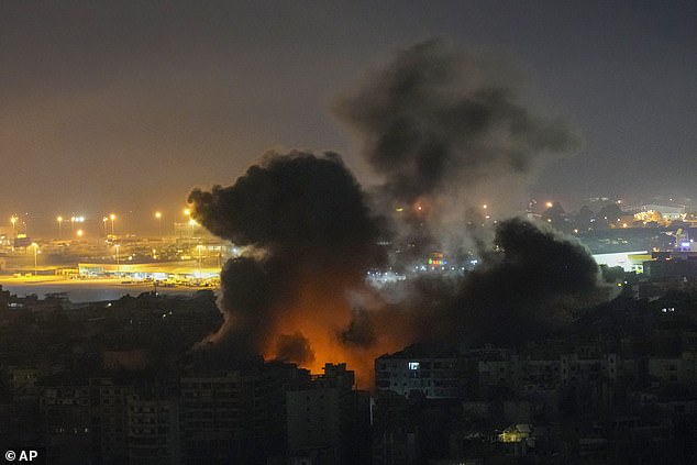 Flames and smoke rise into the sky today after an Israeli airstrike in Dahiyeh, Beirut, Lebanon