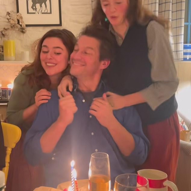 The actor is pictured with Martha and youngest daughter Dora, 18