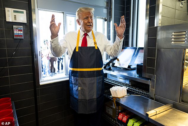 Trump stood behind the fryer of a McDonald's in suburban Philadelphia and manned the drive-thru counter yesterday in an attempt to undermine Democratic candidate Kamala Harris