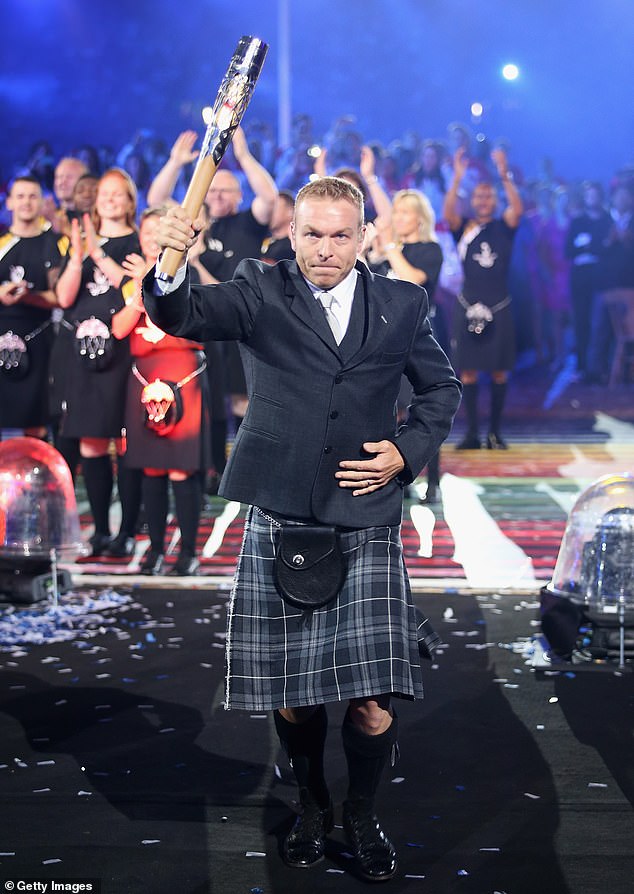 Hoy presents the Commonwealth Games baton at the opening ceremony in Glasgow 2014