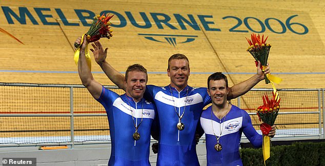 Hoy celebrates team sprint gold with Craig Maclean and Ross Edgar in Melbourne 2006