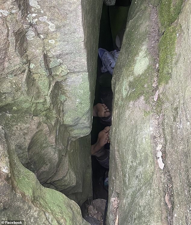 The 'S' shape of the three-metre-long dark hole made it impossible to pull Ms Campbell out (in the photo the Newcastle resident fell upside down, with her feet visible)