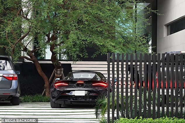 Beckham drives his McLaren 750S into the Miami property, which has been sold for £60 million