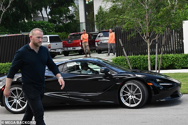 Beckham arrives at the house in his McLaren 750S after buying it for £60 million