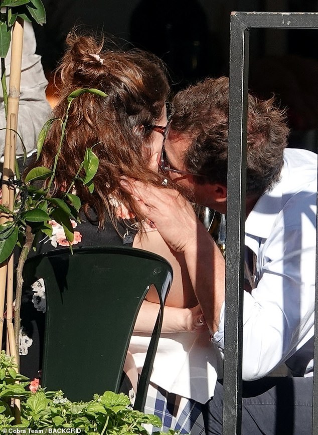 The married Crown actor appeared happier than ever after revealing how photos of him embracing co-star Lily James during a private outing in Rome in 2020 (pictured) were 'very stressful' for his family