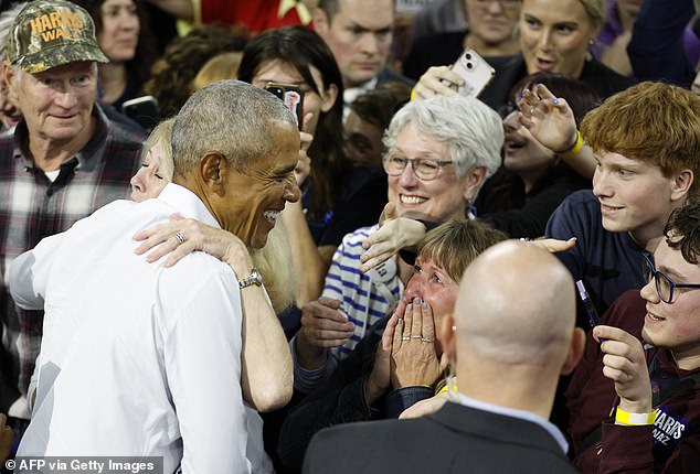 Obama greets his supporters after speaking with Walz at the rally. On Thursday he will campaign with Harris for the first time in Atlanta