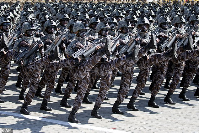 Troops march in a parade to mark the 70th anniversary of North Korea's founding day in Pyongyang