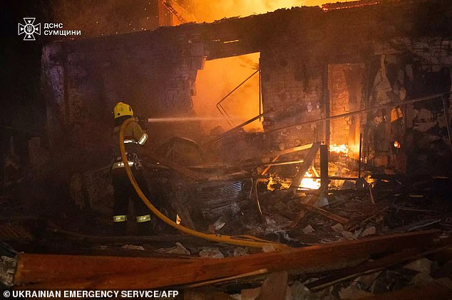 A firefighter working at the scene of a Russian drone attack in Sumy during the Russian invasion of Ukraine on October 22, 2024