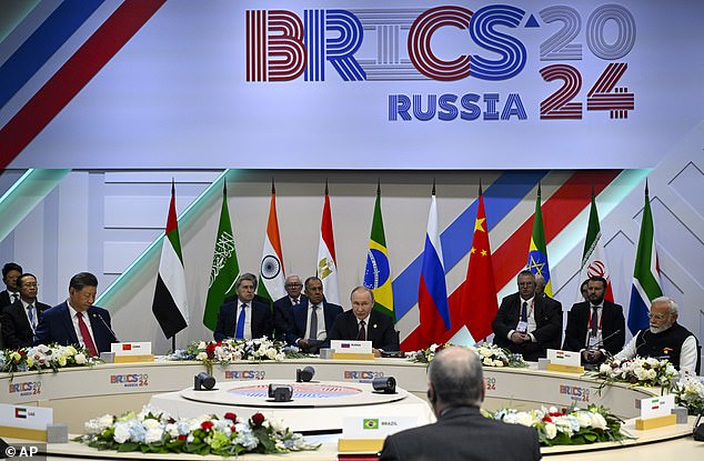 Chinese President Xi Jinping, third from left, Russian President Vladimir Putin, center, and Indian Prime Minister Narendra Modi, right, attend the BRICS narrow format summit session in Kazan, Russia, Wednesday, October 23, 2024