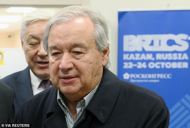 UN Secretary General Antonio Guterres takes part in a welcome ceremony at an airport as he arrives to attend the BRICS Summit in Kazan, Russia, October 23, 2024