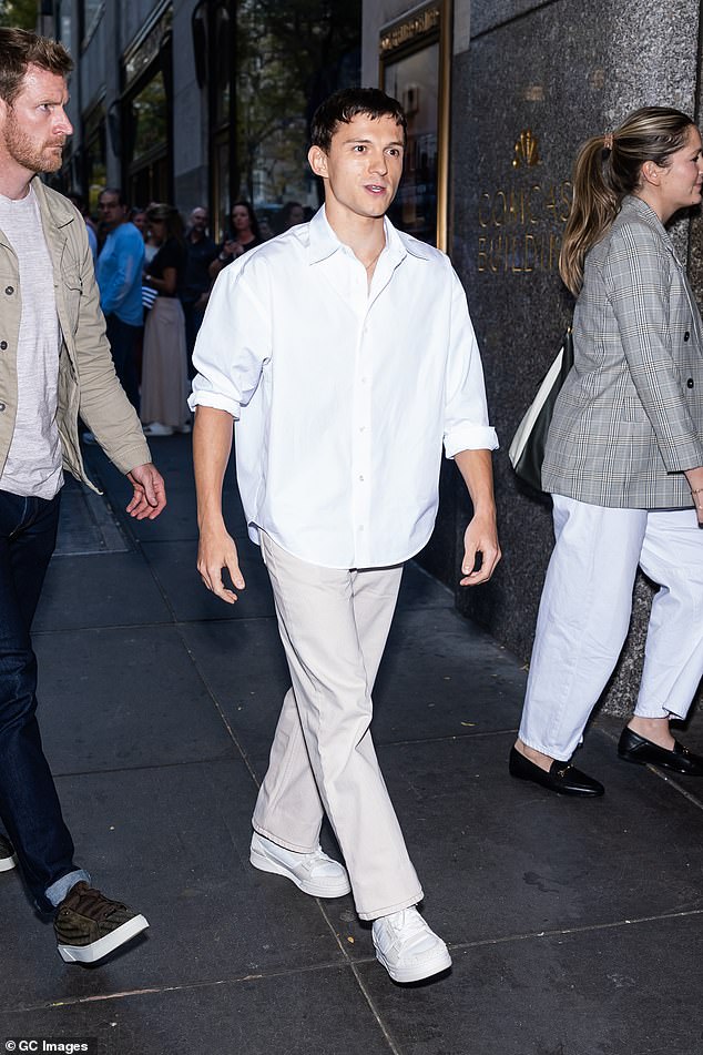 Tom looked dapper in beige Ami jeans, a white Ami shirt and Axel Arigato Clay sneakers as he arrived to appear on Jimmy Fallon's show