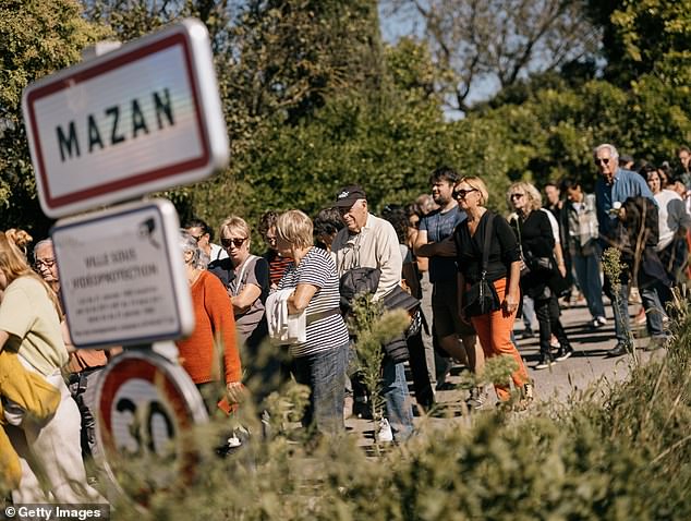 People take part in a march in support of rape victim Gisele Pelicot on October 5, 2024 in Mazan, France