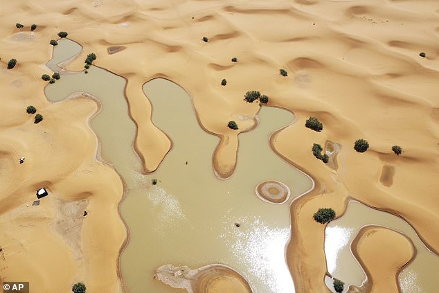 A view of lakes caused by heavy rainfall among sand dunes in the desert town of Merzouga, near Rachidia, southeastern Morocco, Wednesday, October 2, 2024. The Moroccan government said two days of rain in September exceeded annual averages in several areas