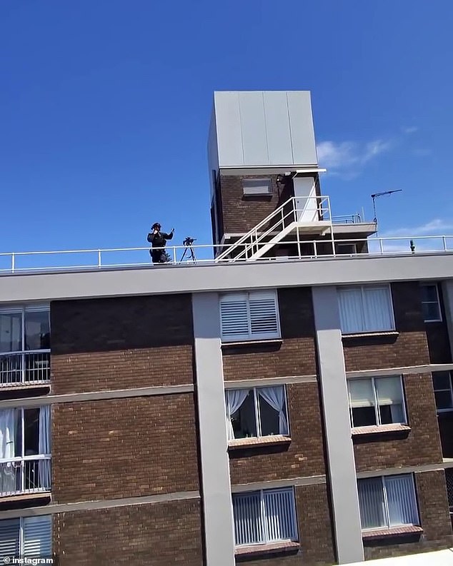 Pollard filmed several interactions with police, including one involving a police sniper (pictured) standing on the roof of an apartment across from Pollard's unit.