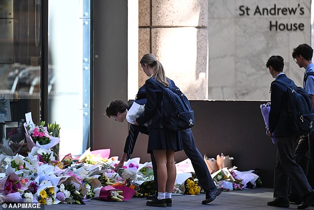 A permanent memorial of a framed wreath, made from the ribbons tied around the flowers left outside in tribute to Lilie James, now hangs in the school and will be placed in the foyer occasionally